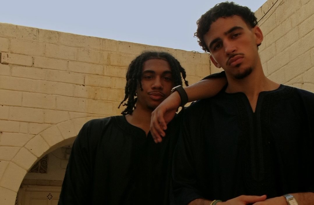 Amaanstudios menswear campaign photographed against warm stone in Tunisia